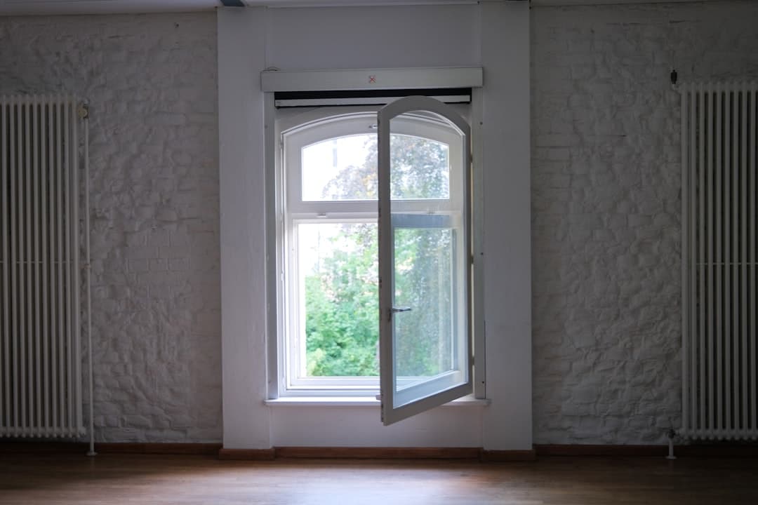 Window with privacy film filtering natural light