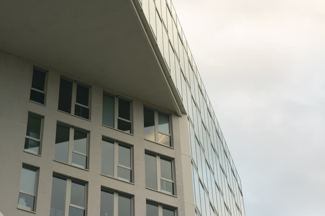 Modern building with glass facade showing window film alternative to blinds